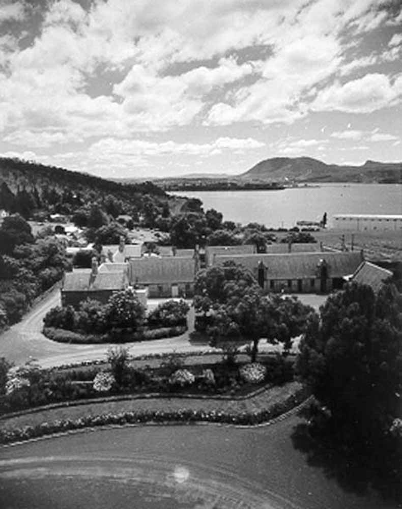 1959 Government House outbuildings looking towards Mount Direction with ANM shed in background TAHO