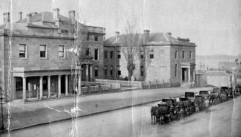 The Post Office and Treasury buildings Murray St, Hobart, looking down Murray St. A line of hansom cabs in the foreground 1870 TAHO