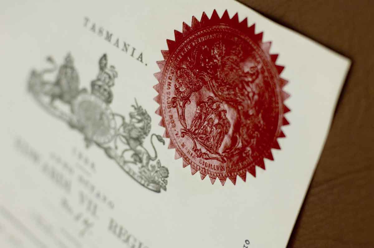 a government document with a seal stamp in focus
